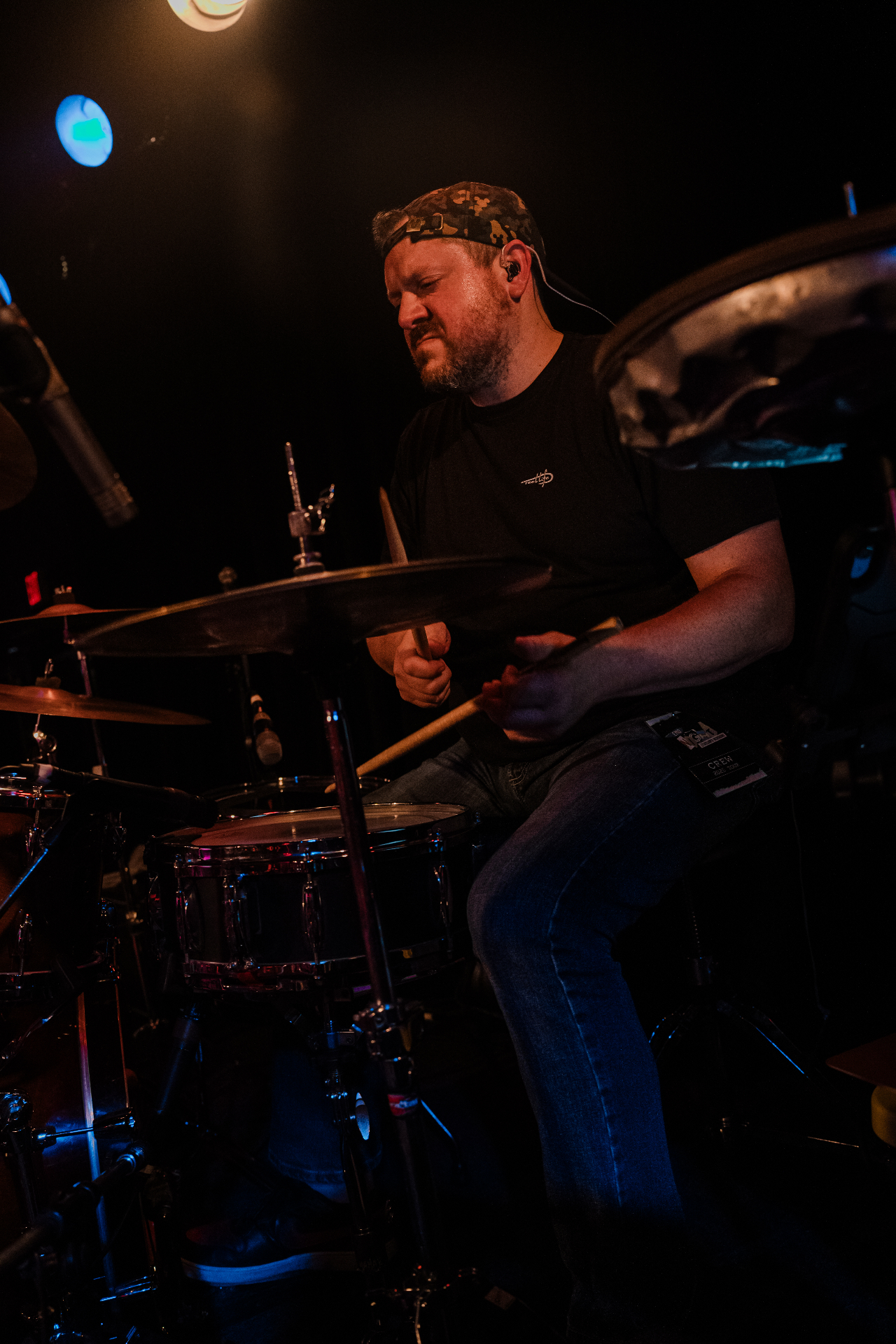 Portrait of Sam Sherman holding drumsticks